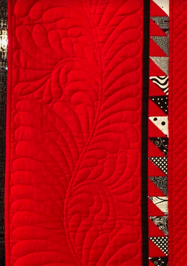 "Black and White and Red All Over" by Jan M. Hutchison and Mary Eilerts - Border